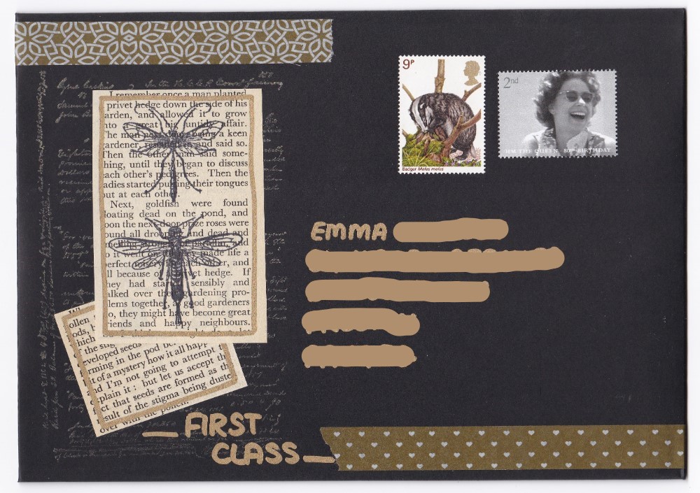 Beautiful black and gold envelope with insect rubber stamps and postage stamps